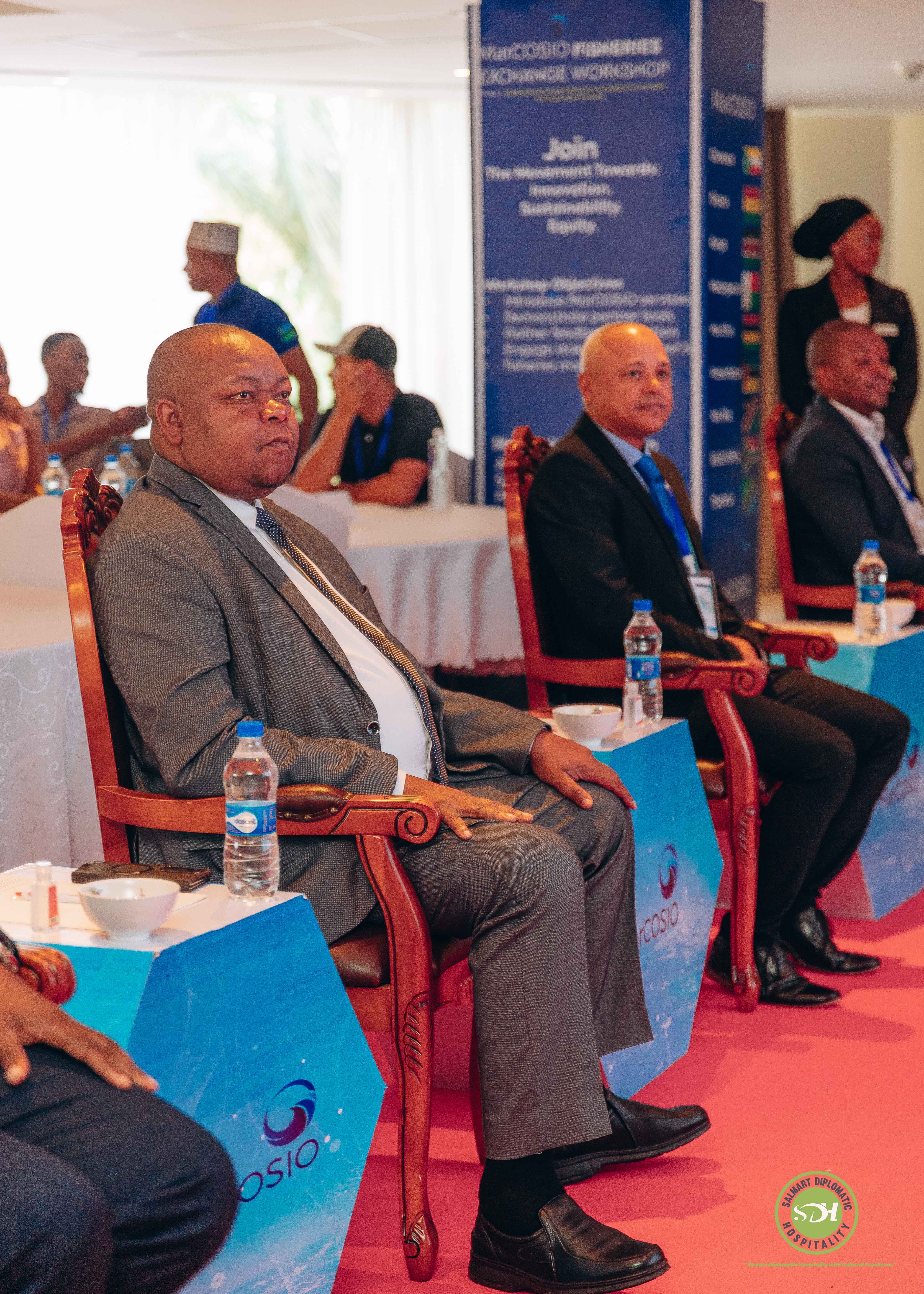 Professional delegates in discussion during a high-level engagement
